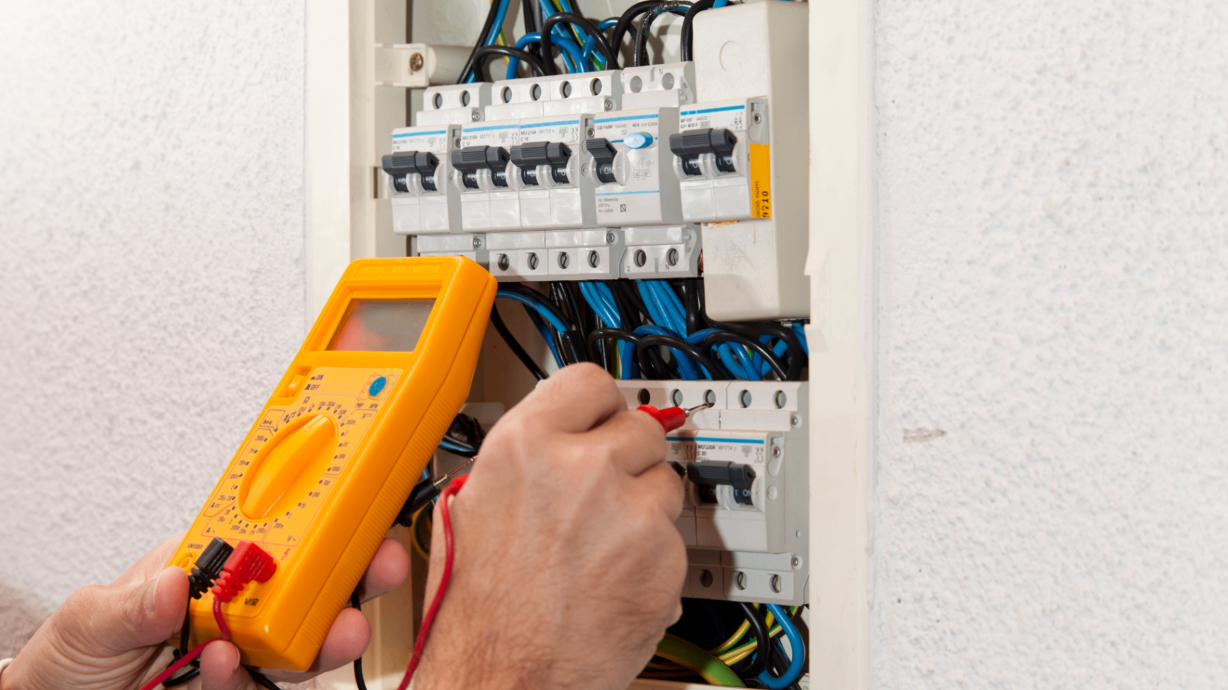 Electrician carrying out an EICR test on a consumer unit in Crewe